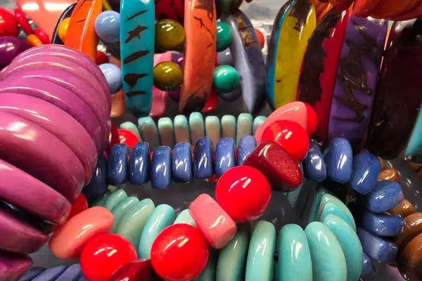 Vibrant glossy resin bangles in bold pink blue red and teal from the all bracelets collection