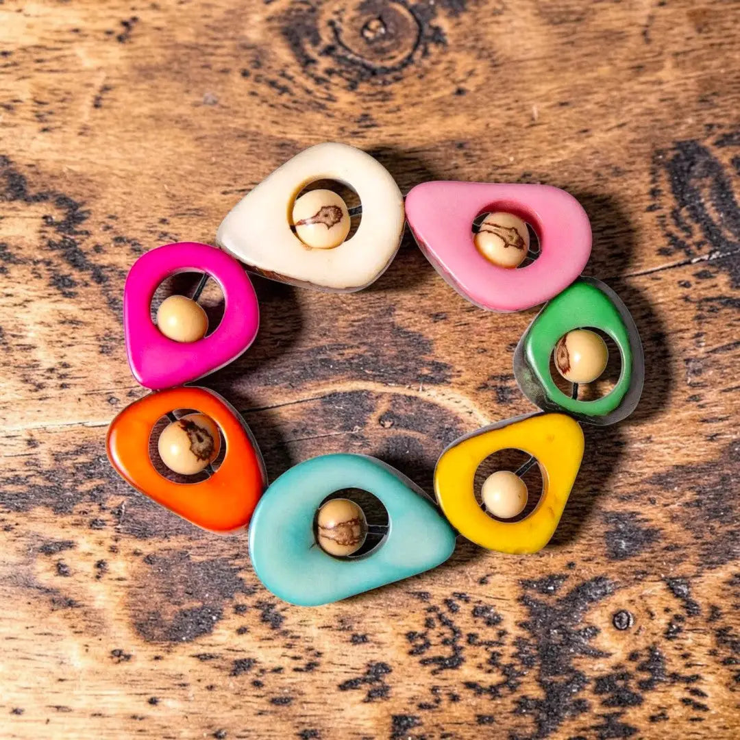 Vibrant turquoise plastic bangle with bold geometric design perfect for adding a pop of color to any outfit