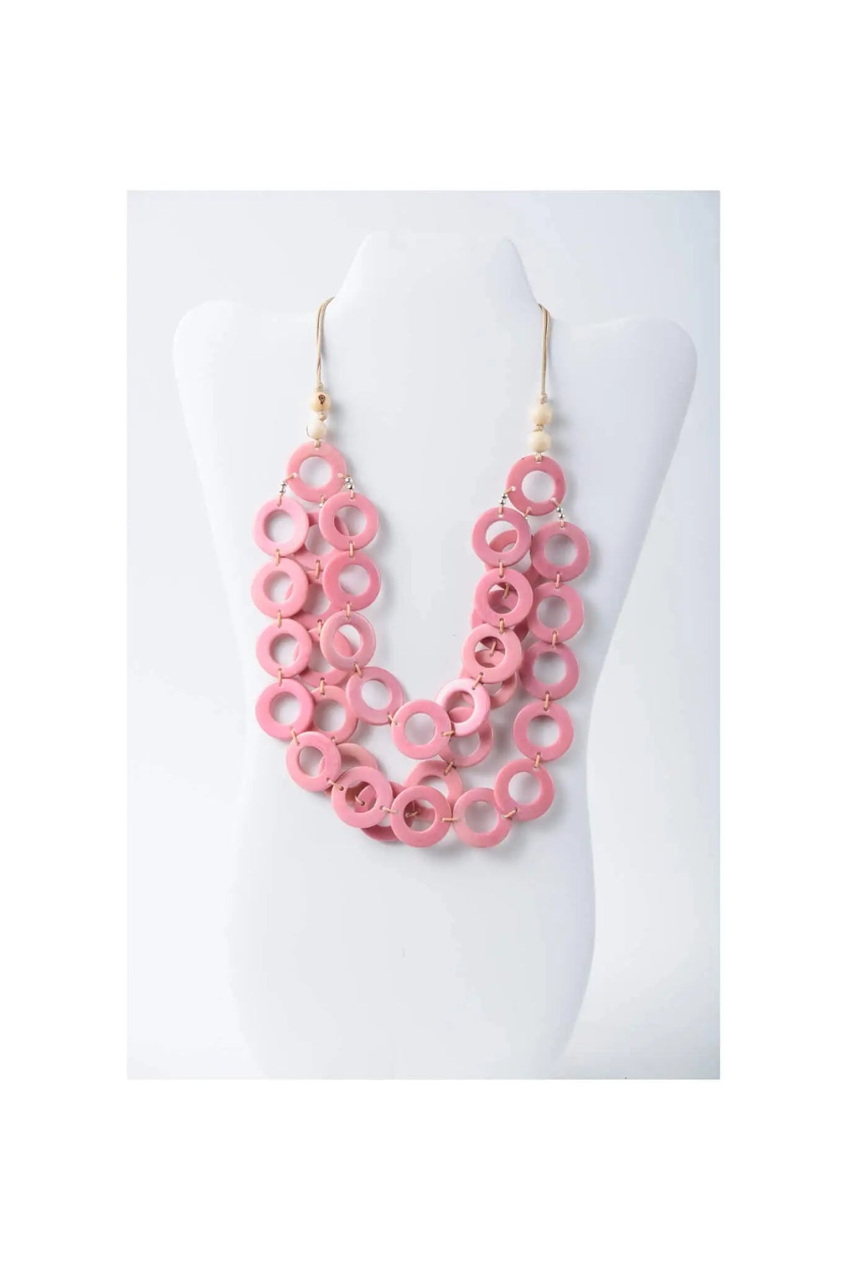 Pink wooden ring necklace with gold toned hooks and pearl accents from aquilia layered circle tagua necklace pink