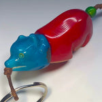 A glossy red and blue hand-carved tagua animal keychain with green bead and braided cord from bear carved rainforest friends