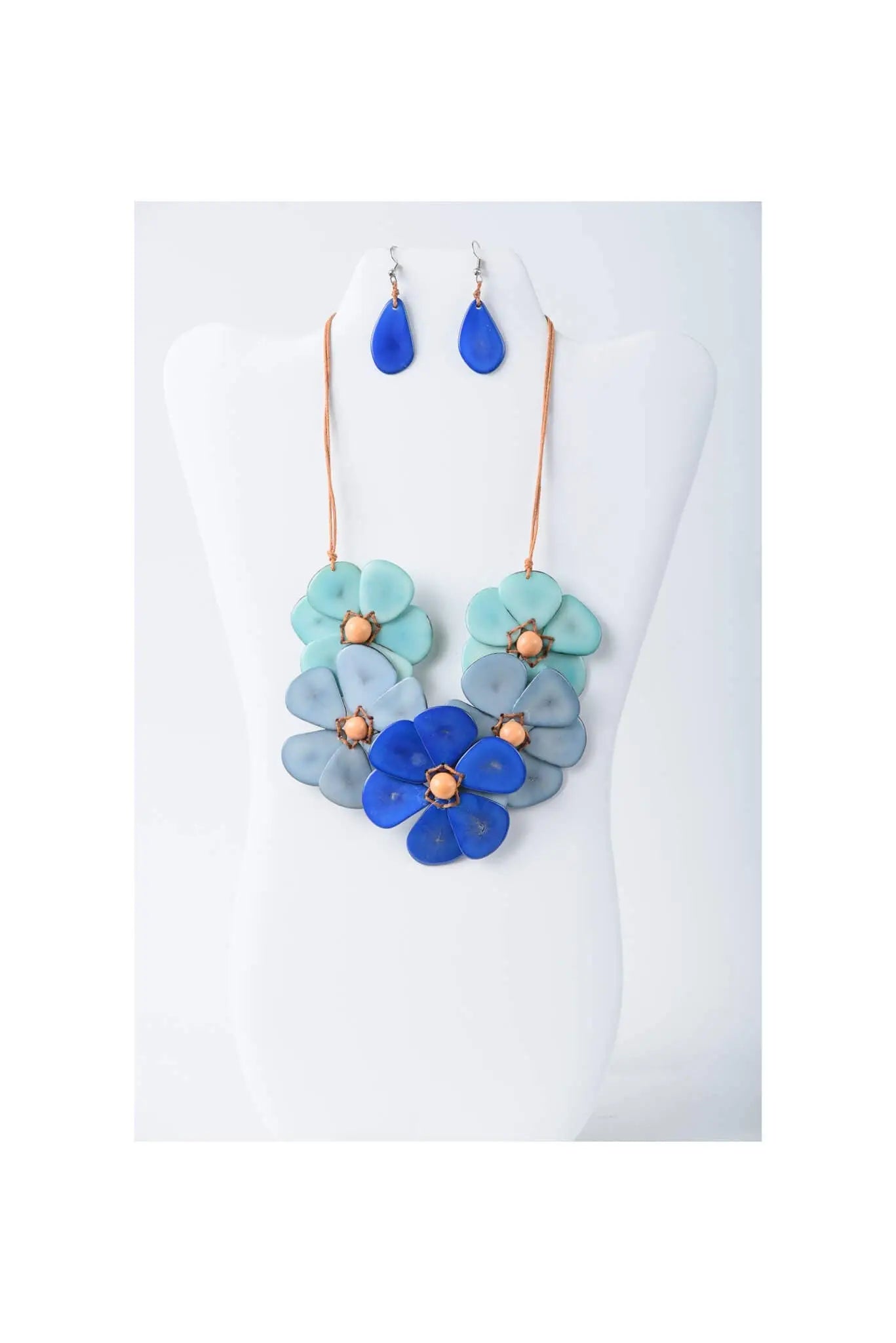 Becca handmade flower bib necklace set with blue and teal resin petals and copper toned centers with matching earrings
