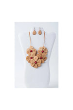 Tan leather flower bib necklace set with red gemstone centers and matching drop earrings by Becca Handmade