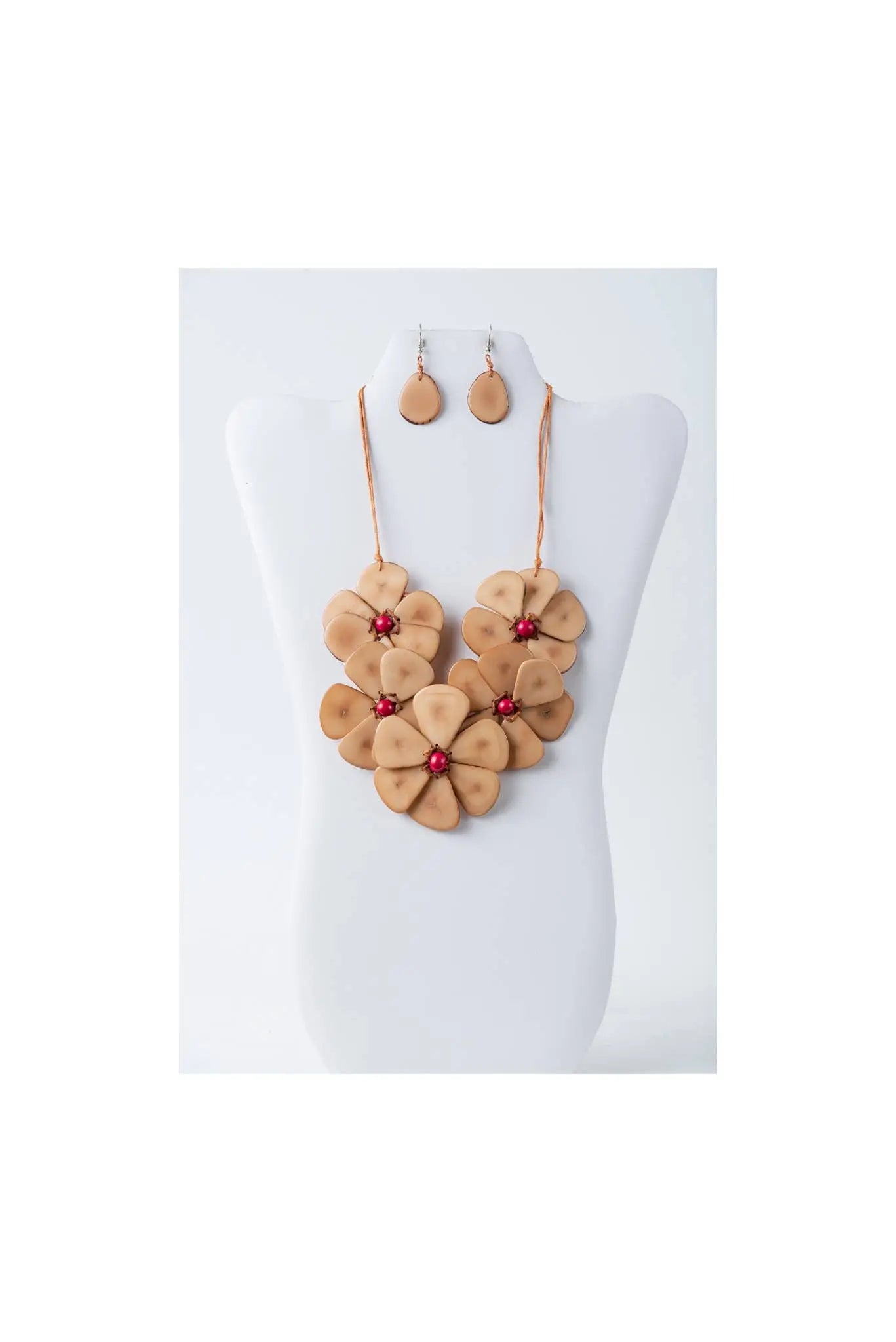Tan leather flower bib necklace set with red gemstone centers and matching drop earrings by Becca Handmade