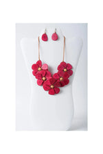 Vibrant fuchsia flower bib necklace set with layered tagua petals and wooden centers plus matching teardrop earrings