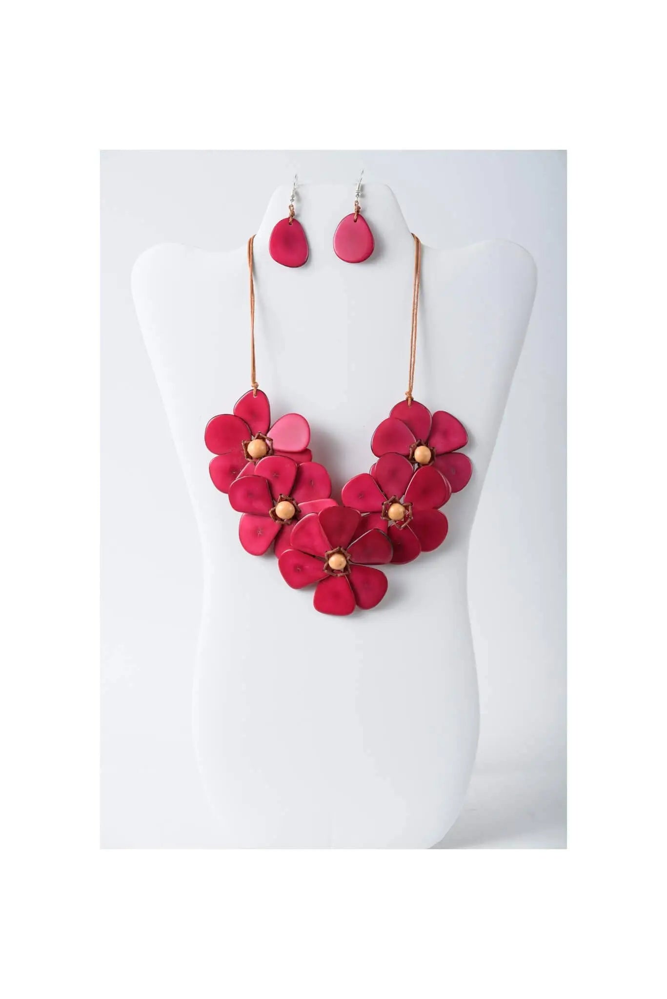 Vibrant fuchsia flower bib necklace set with layered tagua petals and wooden centers plus matching teardrop earrings