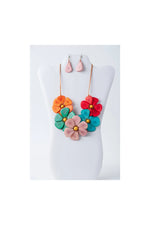 Becca handmade flower bib necklace with vibrant layered petals in orange red teal pink and gold centers