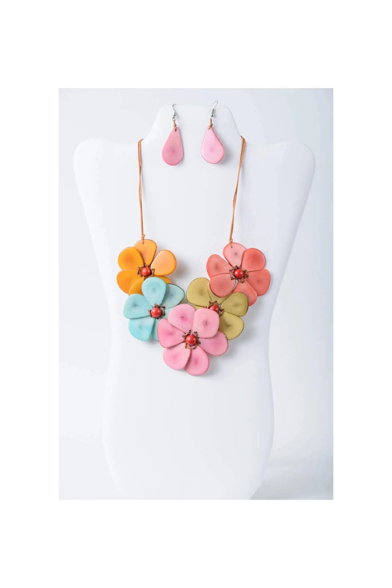 Vibrant becca handmade flower bib necklace with pink orange teal petals and red gemstone centers in tagua material