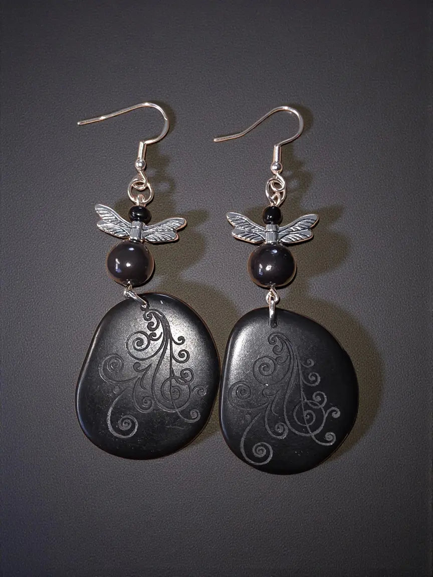 Black ghost swirl laser engraved lightweight tagua slice earrings with black stone and silver dragonfly charms