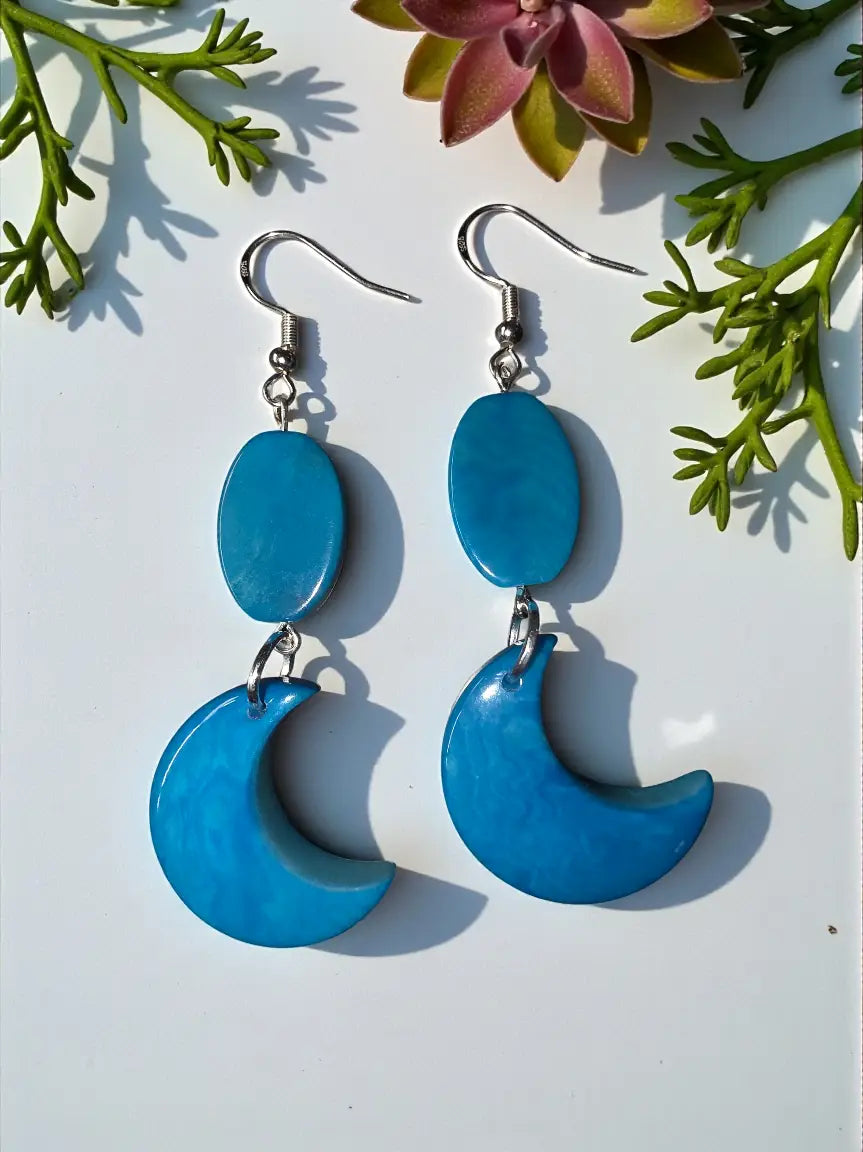 Blue crescent moon and oval drop earrings with silver hooks featuring flat tagua beads and lightweight plastic-free design