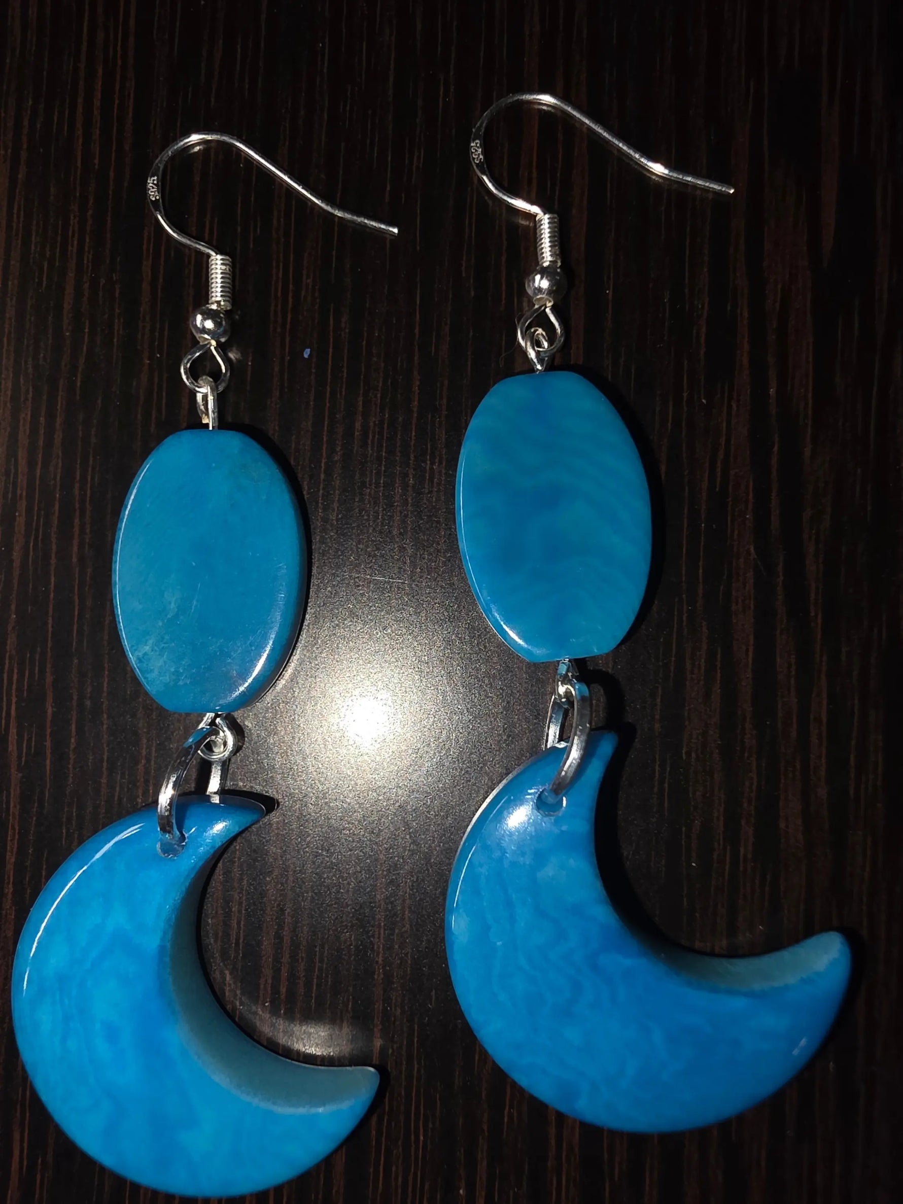 Bright blue crescent moon earrings with flat tagua beads smooth glossy finish silver toned hooks plastic free