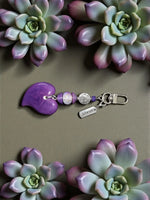 Brave purple tagua carved heart keychain with silver-toned clasp and tibetan amulet metal bead charm