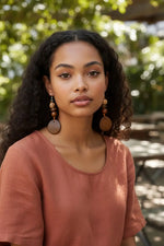 Brown tagua carved vegetable ivory earrings with earthy brown wooden discs and forest seeds ensemble from the rainforest