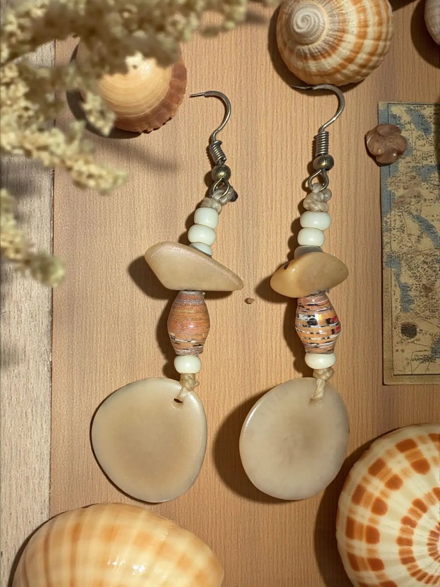 Beige shell buttercream sunday easy to wear small tagua slice earrings with layered rounded beads and sea-inspired patterns