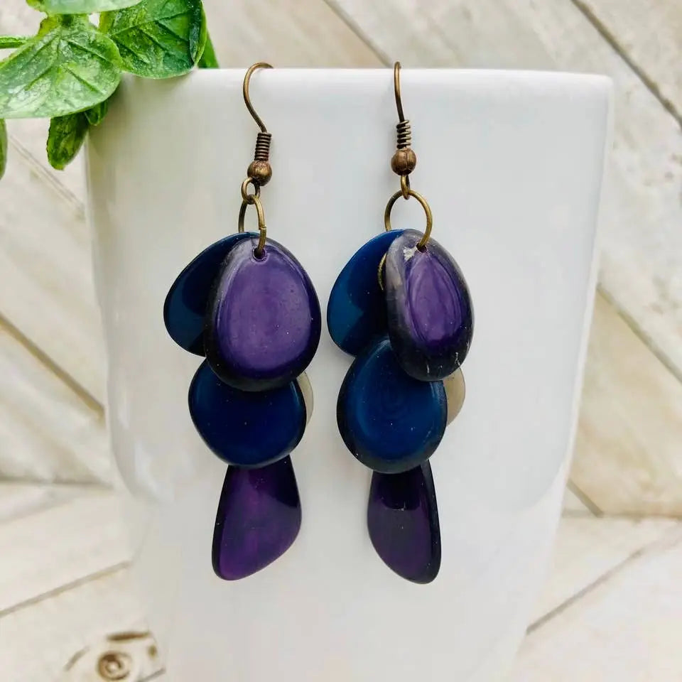 Cascada earrings featuring layered purple and navy blue shell with bronze hooks for a stylish look