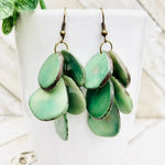 Green layered ceramic pendant cascada earrings with rustic finish and bronze hooks seafoam color