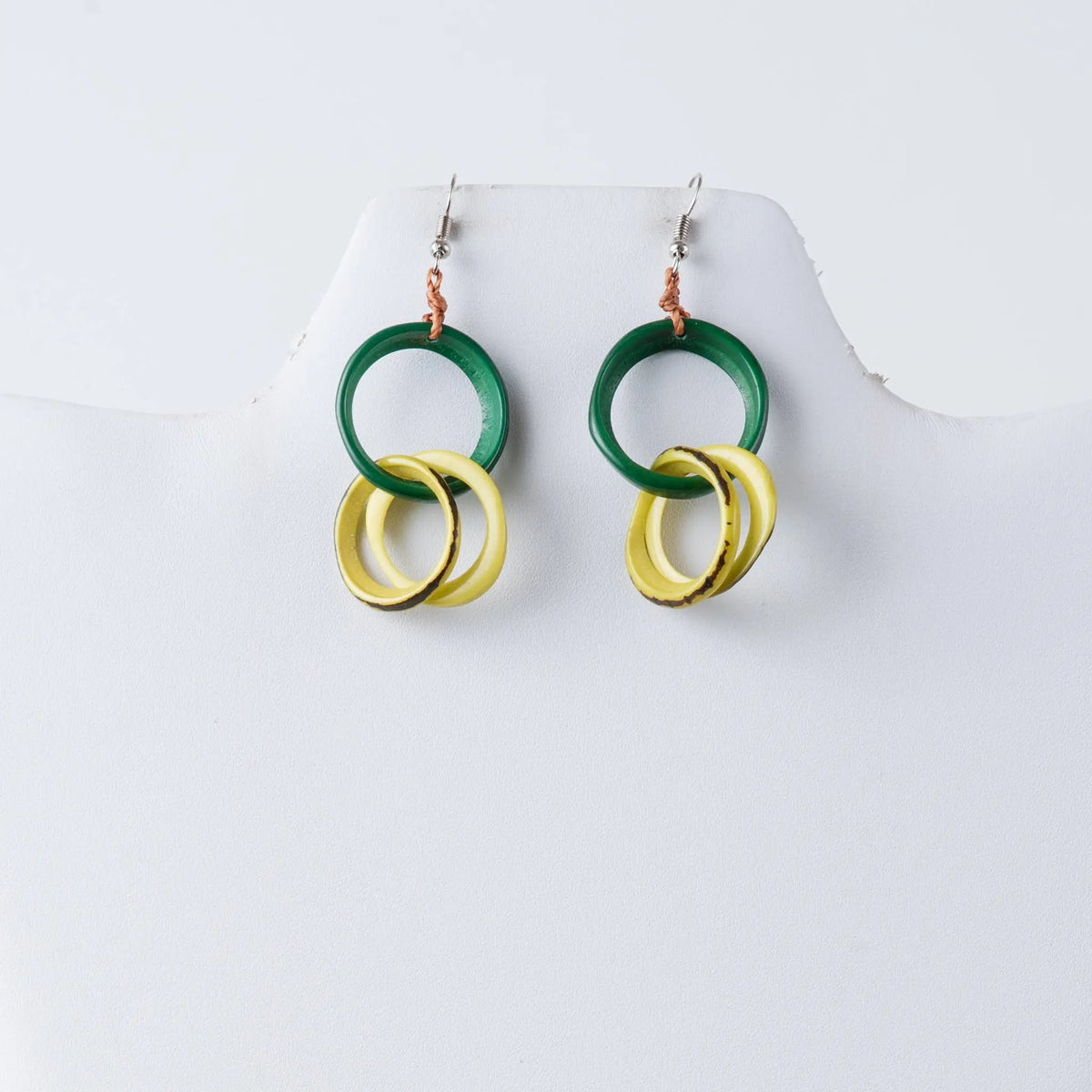 Catalina circular tagua earrings in green and yellow with layered stacked circular tagua hoop design