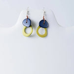 Blue and yellow ceramic drop earrings with rustic knot detail from charli geometric tagua earrings collection