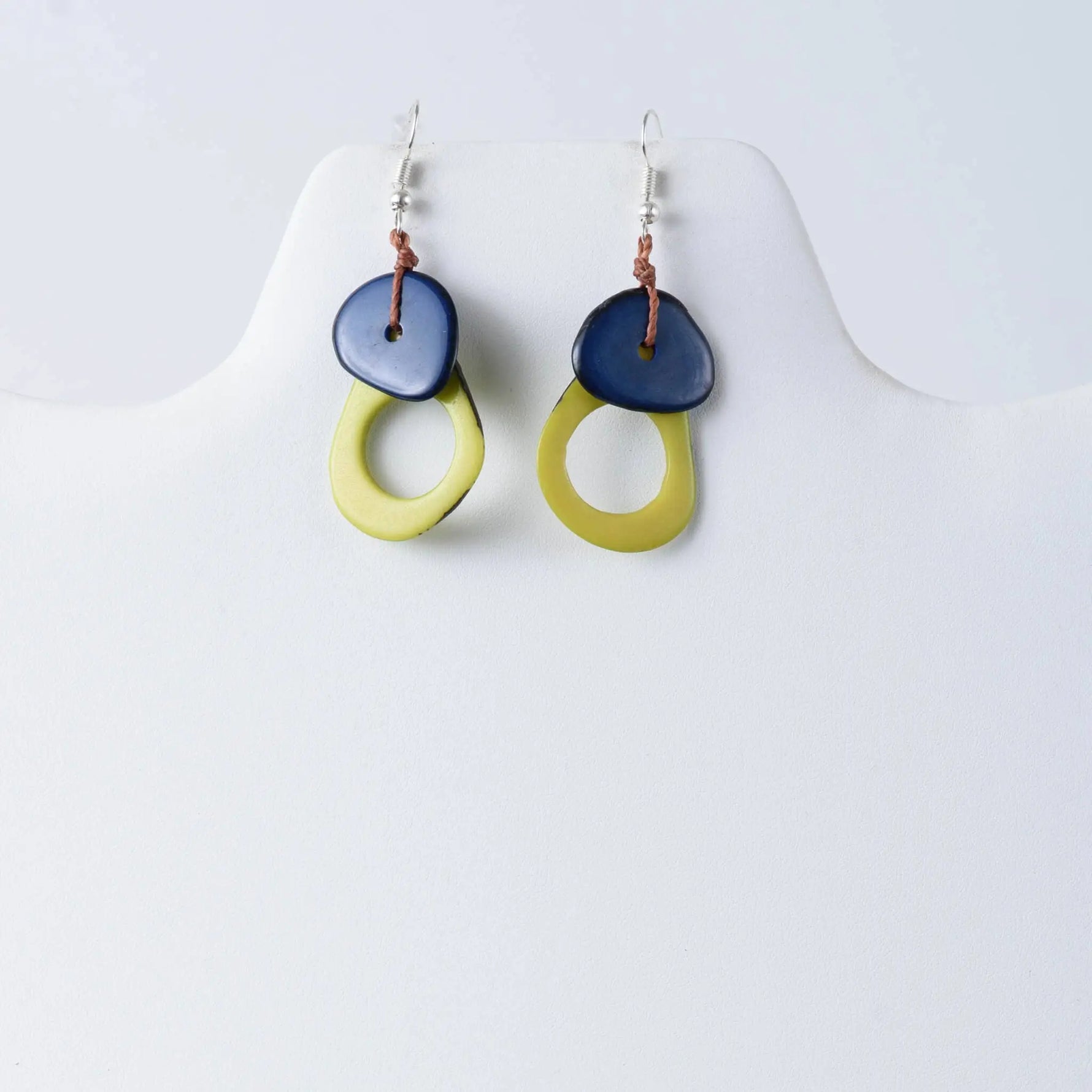 Blue and yellow ceramic drop earrings with rustic knot detail from charli geometric tagua earrings collection