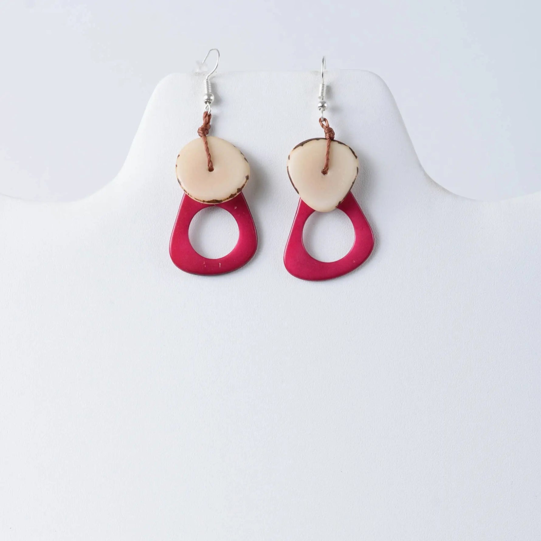 Charli geometric tagua earrings are vibrant fuchsia and cream resin drops with natural wood edge detail