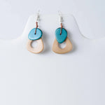 Teal and beige ceramic drop earrings with a simple modern design from the charli geometric tagua collection