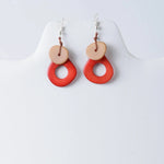 Charli geometric tagua earrings with vibrant red and beige layered drop design and rustic handcrafted style
