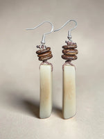 Elegant cream raw edge tagua vegetable ivory earrings with polished jadeite and forest seeds in silver hooks