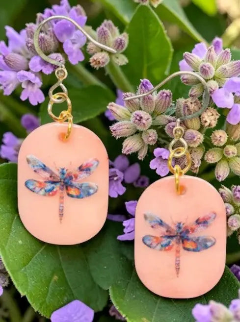 Peach-colored eleni earrings with painted dragonfly tagua nut design and gold-toned hooks for a cute look