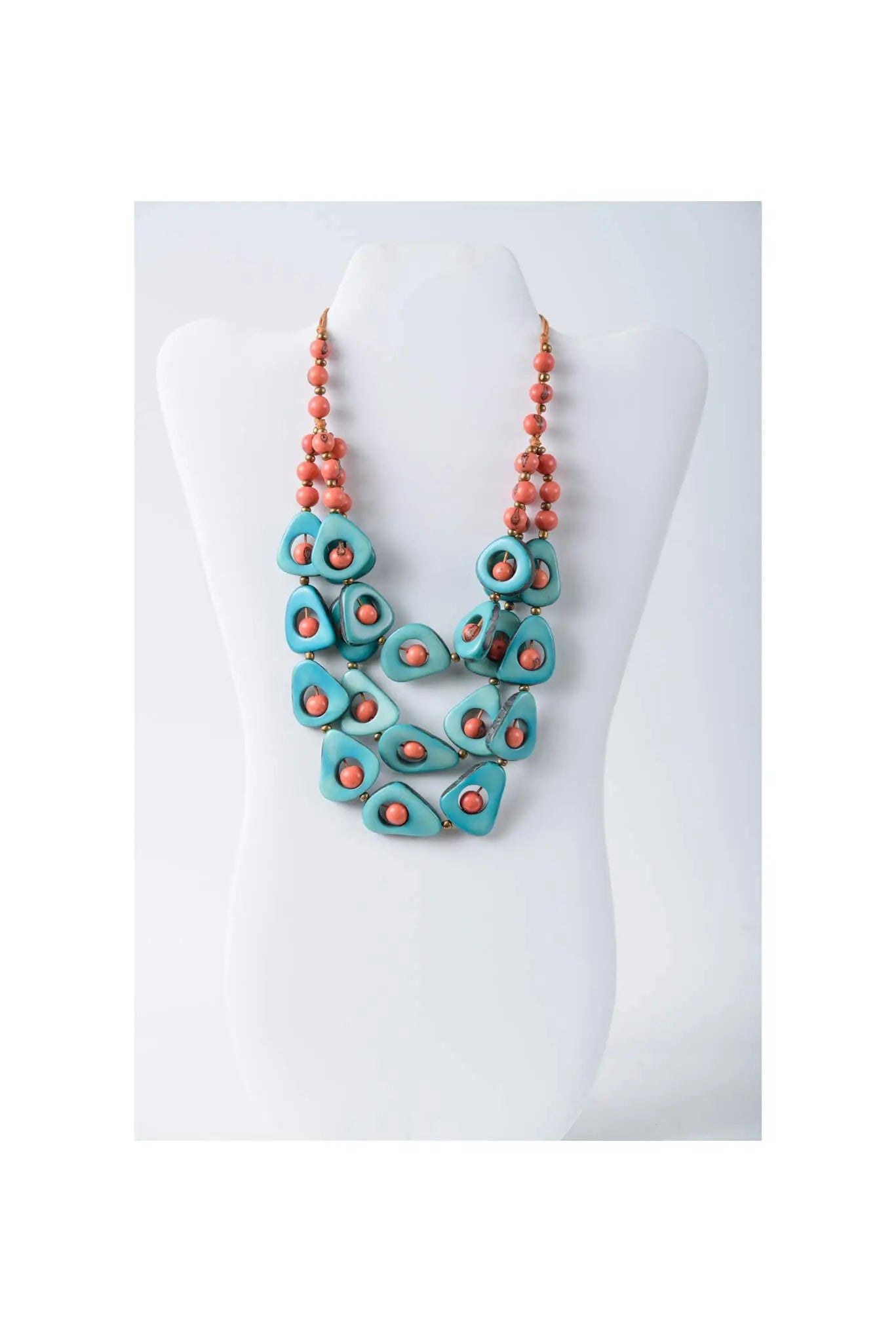 Eden three stranded tagua necklace set with turquoise and coral teardrop beads featuring orange accents
