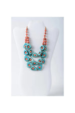 Eden three stranded tagua necklace set features a layered turquoise and coral tagua necklace with teardrop beads and orange accents
