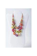 Vibrant multi-layered eden three stranded tagua necklace set with avocado-shaped beads in pink green purple and cream