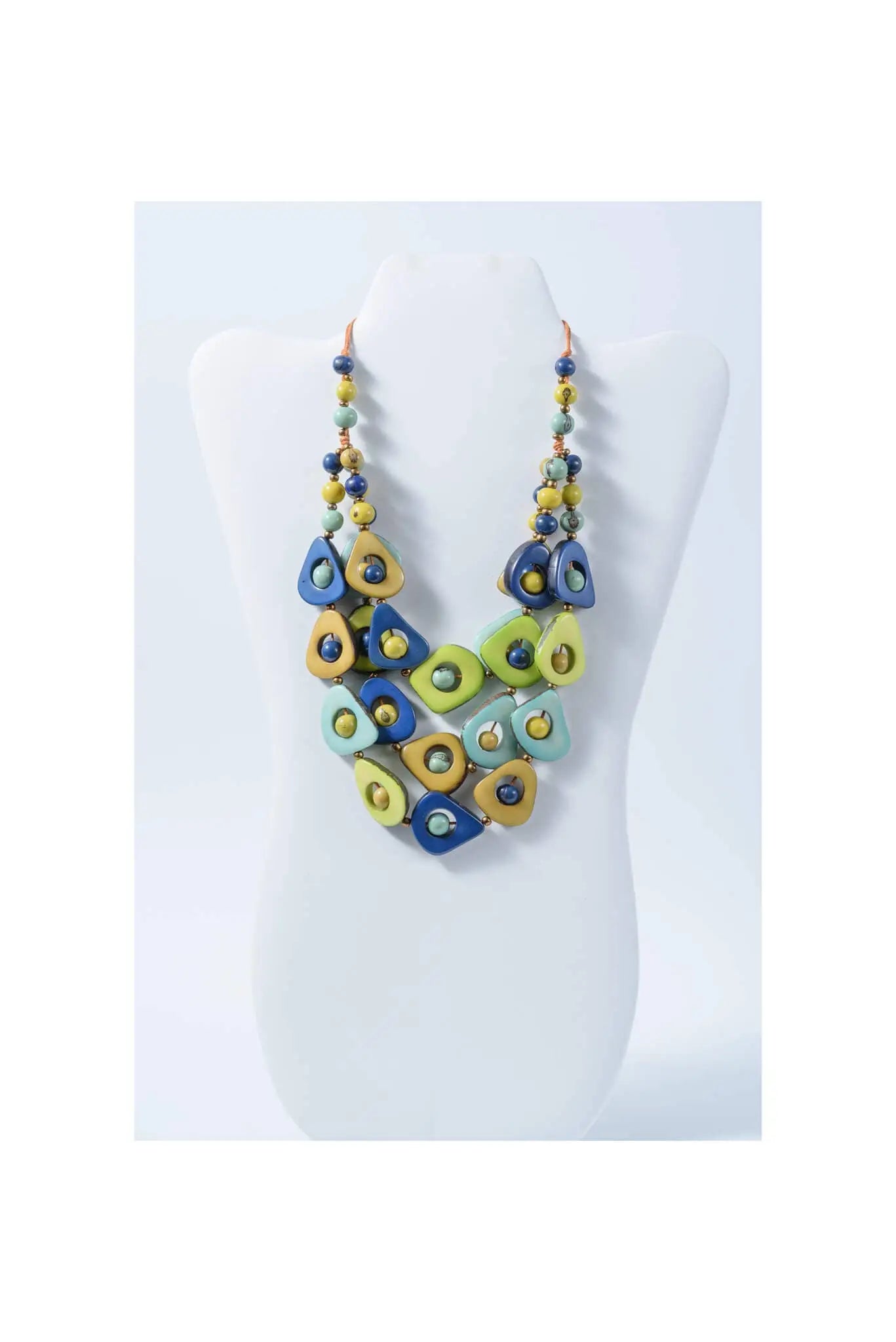 Eden three stranded tagua necklace with vibrant blue green and yellow teardrop beads and smaller round accents