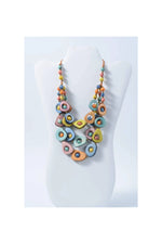 Eden three stranded tagua necklace with pastel oval beads glossy finish and metallic accents for vibrant style