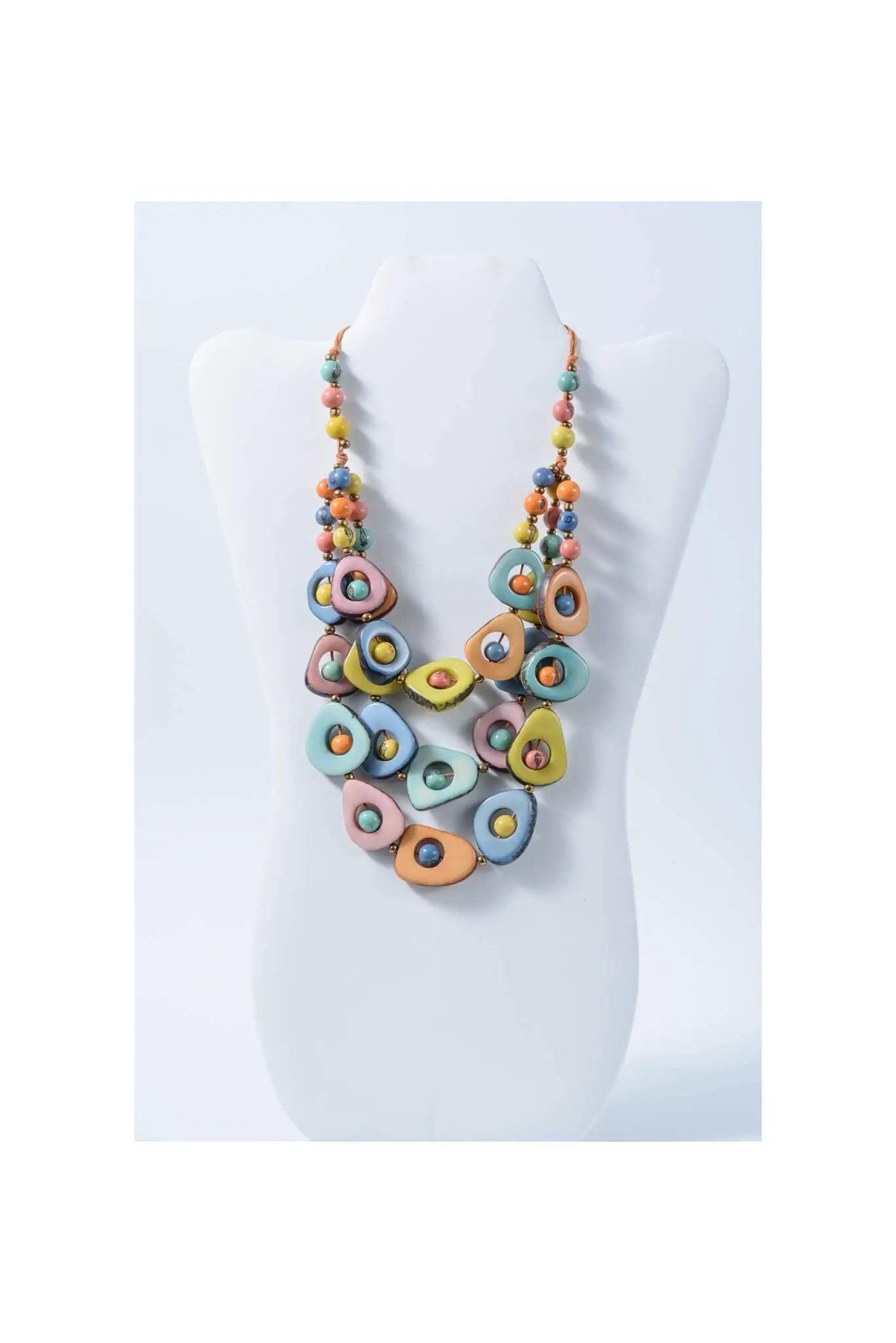 Eden three stranded tagua necklace with pastel oval beads glossy finish and metallic accents for vibrant style