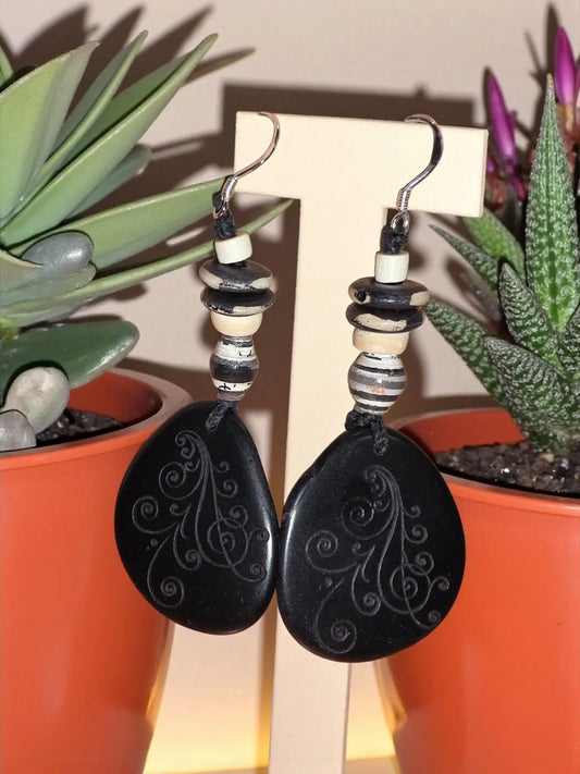 Favorite black ghost swirl engraved earrings with black teardrop shape silver etchings and black cream striped beads