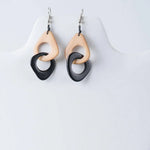 Black and beige teardrop resin fern interlocking tagua earrings with a modern minimalist design