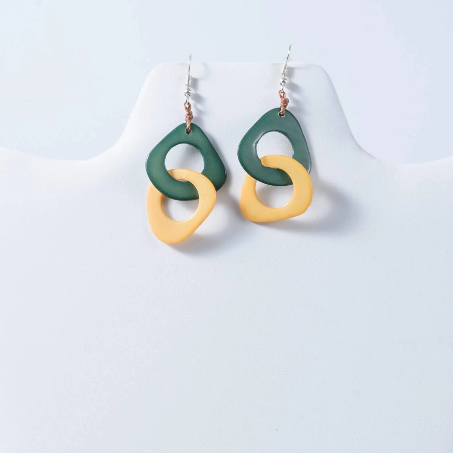 Green and yellow abstract ring earrings with glossy resin finish from fern interlocking tagua earrings collection