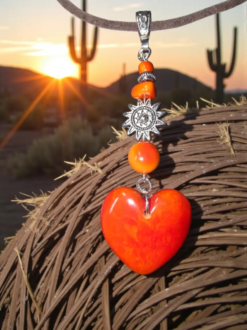 Vibrant flame orange carved heart meets sun amulet pendant necklace with silver charm on adjustable leather cord vegan