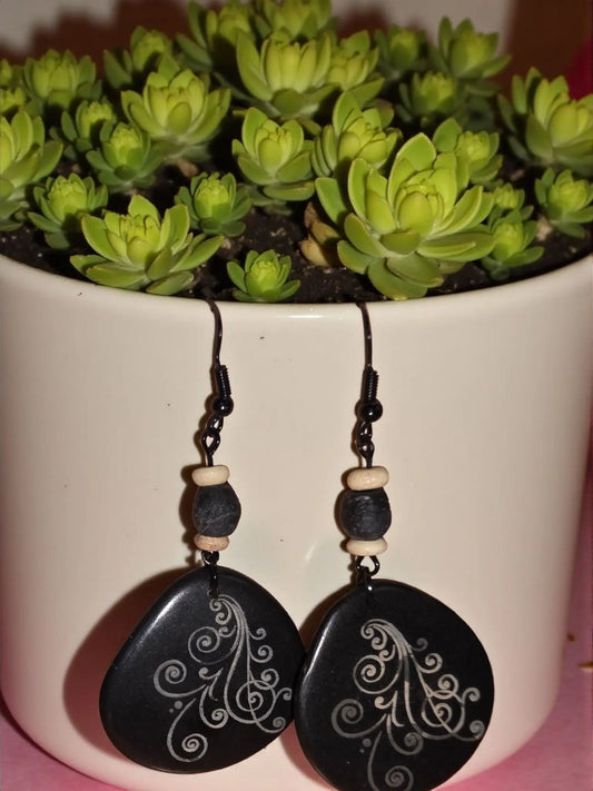 Go-to throw-on and go laser engraved black tagua slice earrings with black teardrop shape silver swirls and dark beads