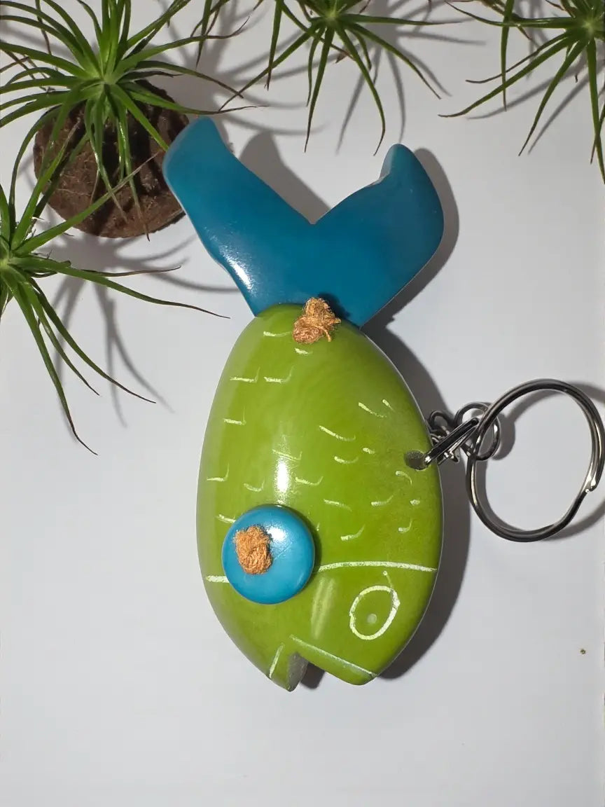 Vibrant green goldfish hand-carved tagua animal keychain with glossy finish and turquoise and orange details