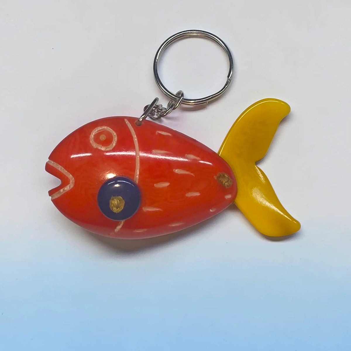 GOLDFISH vibrant red and yellow hand-carved tagua animal keychain with glossy finish and blue eye gold detailing