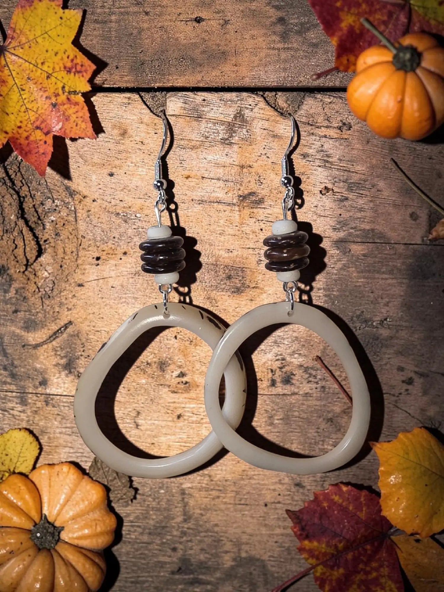 Cream-colored carved hoop lightweight earrings made from gray cream tagua nut vegetable ivory from Ecuadorian rainforest