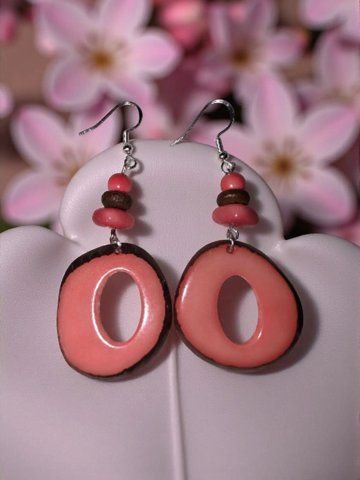 Handmade natural donut cut tagua hoop earrings in salmon pink and brown with thick lightweight beaded design