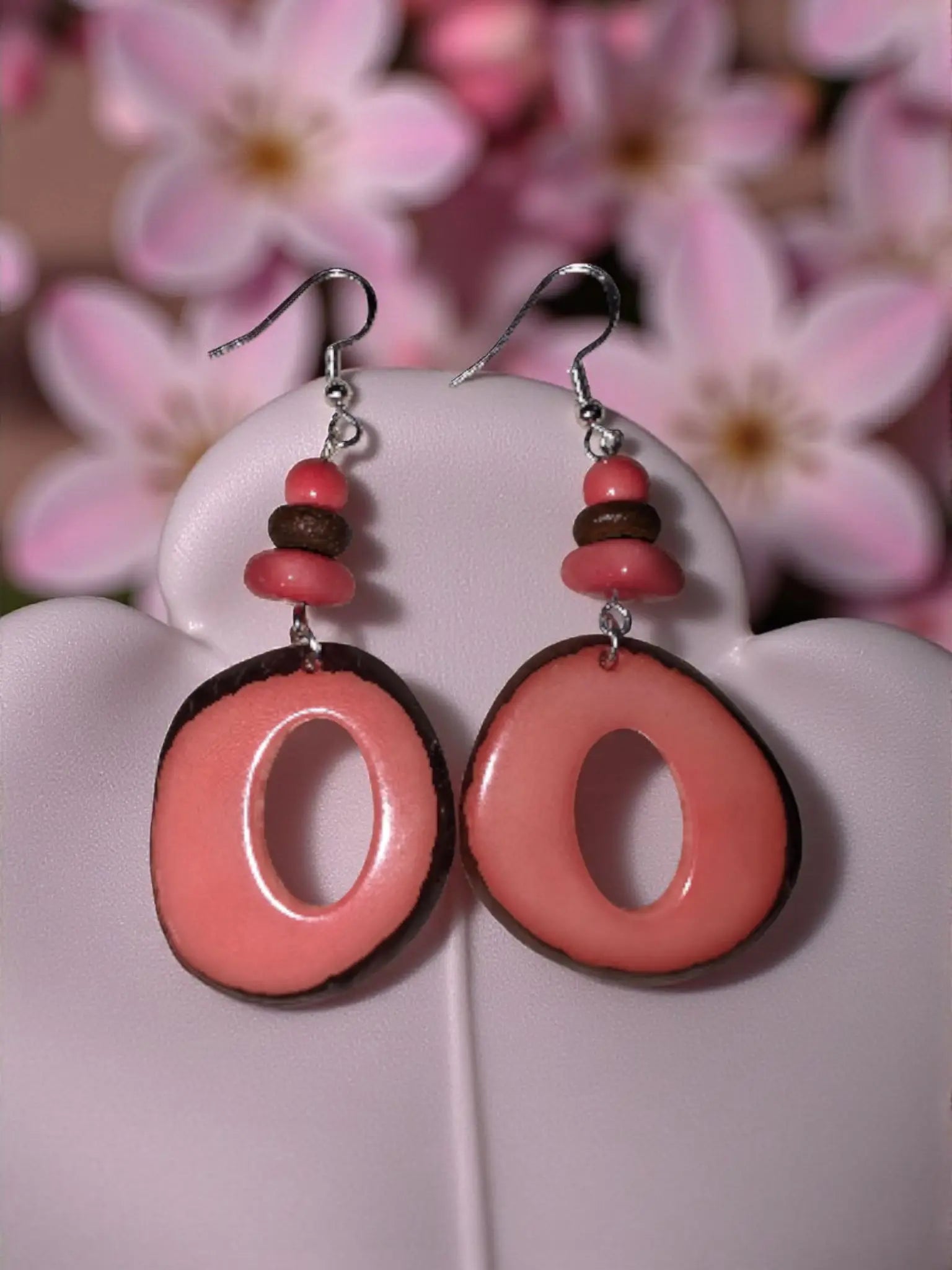 Handmade natural donut cut tagua hoop earrings in salmon pink and brown with thick lightweight beaded design