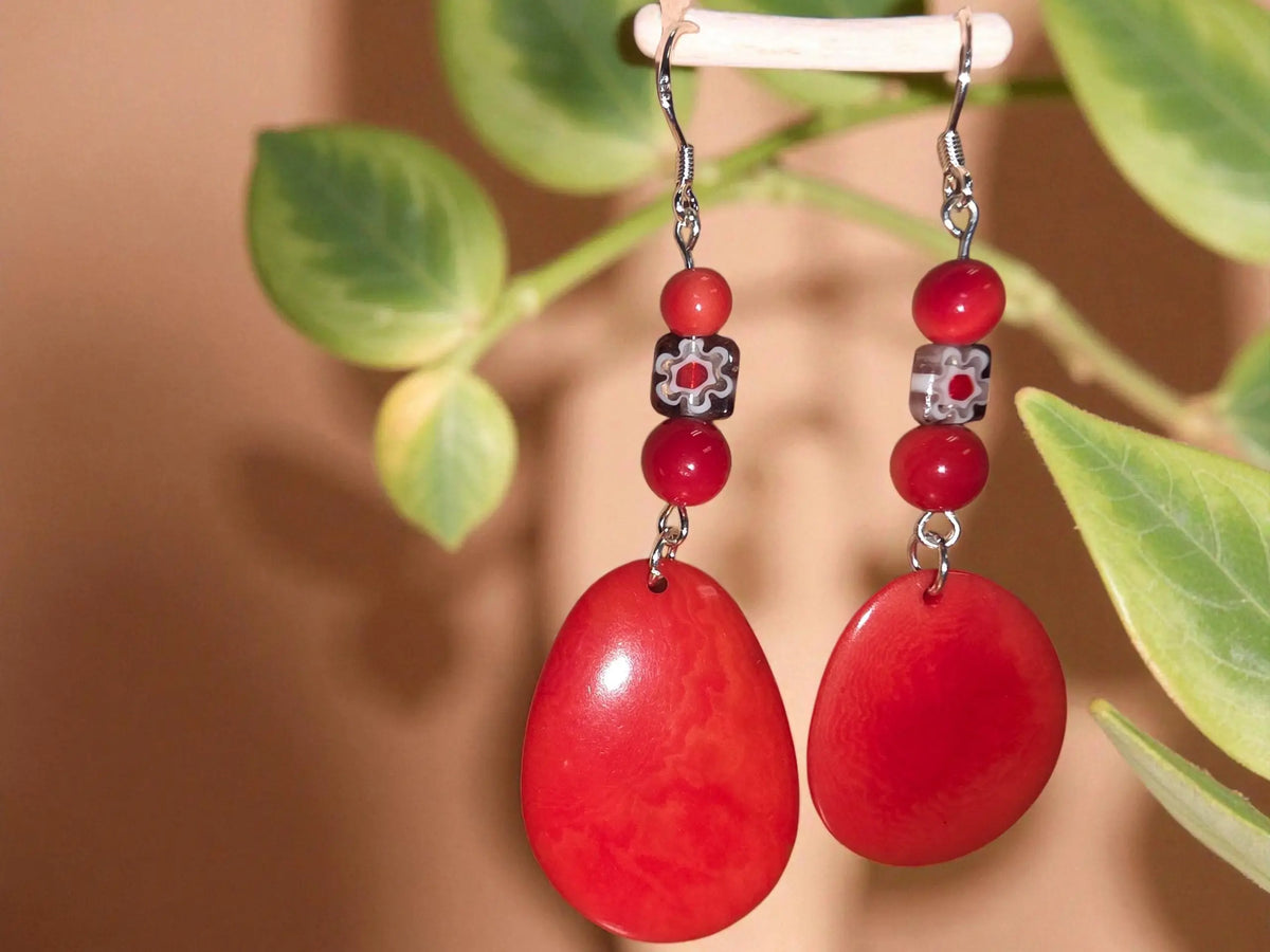 Happy little red polished tagua slice dangle earrings with flower bead and silver hooks featuring teardrop shape