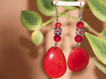 Happy little red polished tagua slice dangle earrings with flower bead and silver hooks featuring teardrop shape