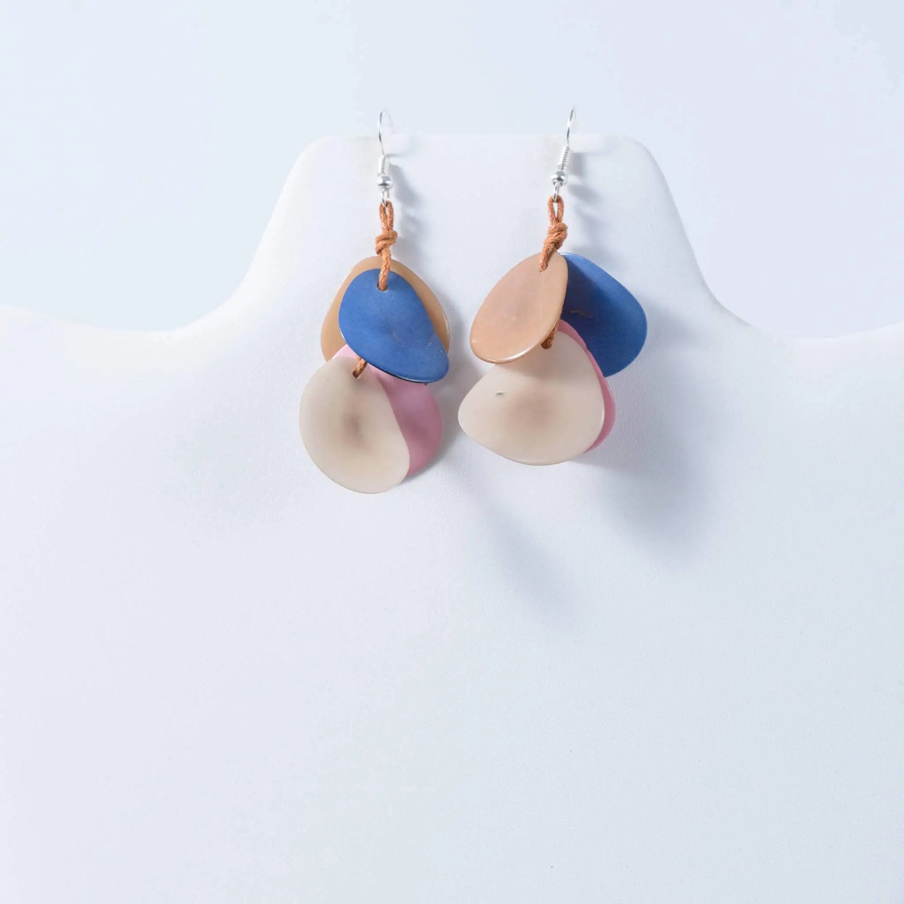 Pastel-colored layered shell-shaped tagua nut earrings with matte finish and silver hooks for stylish wear