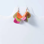 Vibrant holly curved layered tagua nut earrings in orange pink green and beige leaf shapes for stylish looks
