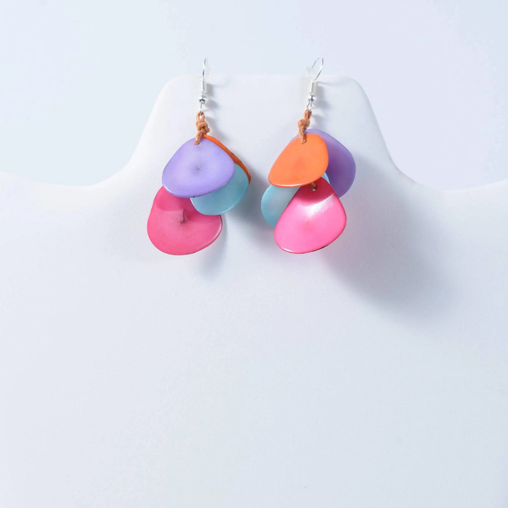 Vibrant holly curved layered tagua petal earrings in pink purple orange and teal made from tagua nut