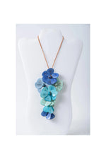 Holly pendant flower tagua necklace with cascading blue and teal flower pendants on a copper chain
