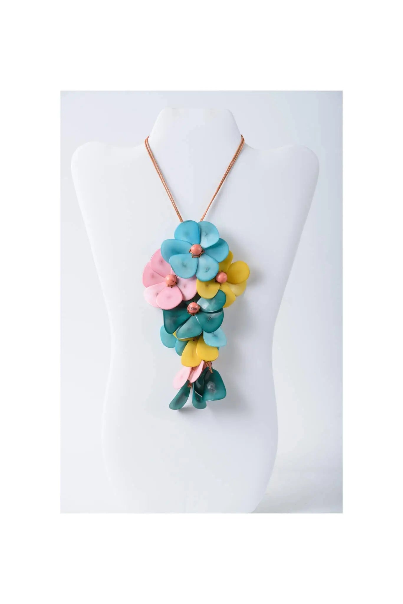 Holly pendant flower tagua necklace with vibrant blue pink and yellow layered petals on a copper-toned chain
